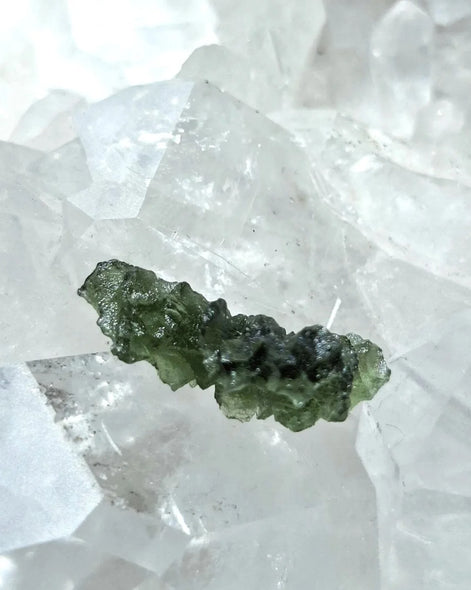 Natural 2.3g Ježkovna Moldavite from Besednice with a transparent green colour and sculpted surface