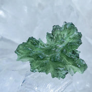Natural 2.3g Ježkovna Moldavite from Besednice with a transparent green colour and sculpted surface