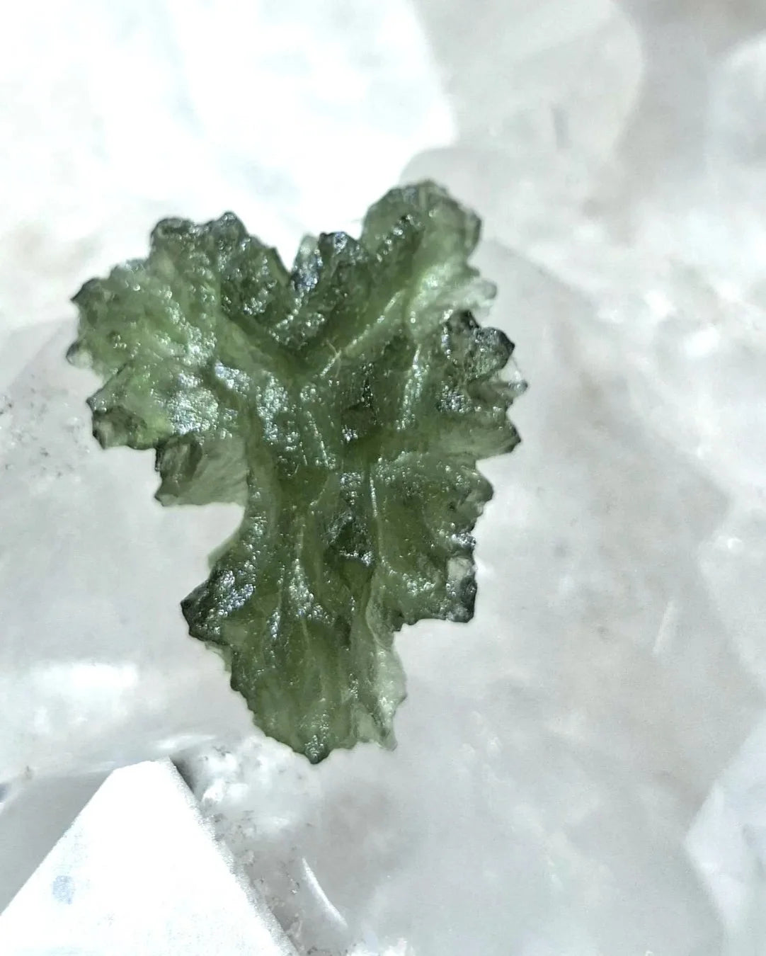 Natural 2.3g Ježkovna Moldavite from Besednice with a transparent green colour and sculpted surface
