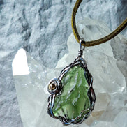 Transparent green 2.0 g Moldavite pendant from Maruškovo Pole wrapped in stainless steel wire with a gold-plated round bead