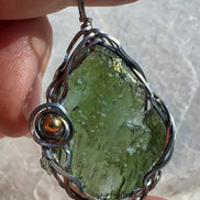 Transparent green 2.0 g Moldavite pendant from Maruškovo Pole wrapped in stainless steel wire with a gold-plated round bead