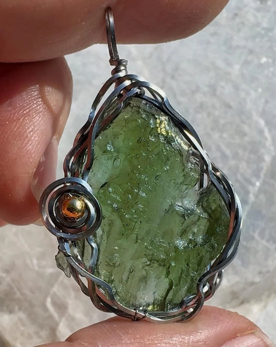 Transparent green 2.0 g Moldavite pendant from Maruškovo Pole wrapped in stainless steel wire with a gold-plated round bead