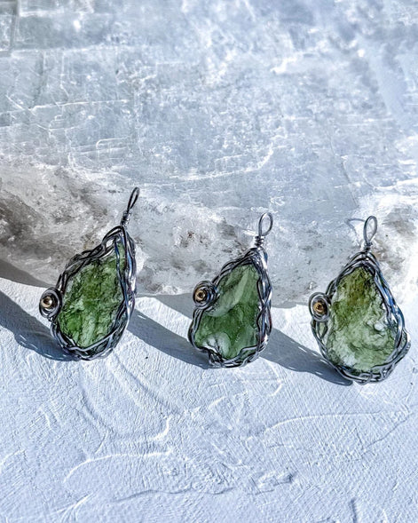 Transparent green 2.0 g Moldavite pendant from Maruškovo Pole wrapped in stainless steel wire with a gold-plated round bead