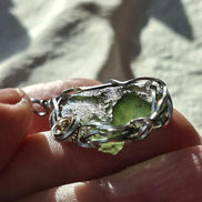 Transparent green 2.0 g Moldavite pendant from Maruškovo Pole wrapped in stainless steel wire with a gold-plated round bead