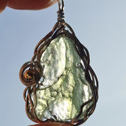 Transparent green 2.0 g Moldavite pendant from Maruškovo Pole wrapped in stainless steel wire with a gold-plated round bead