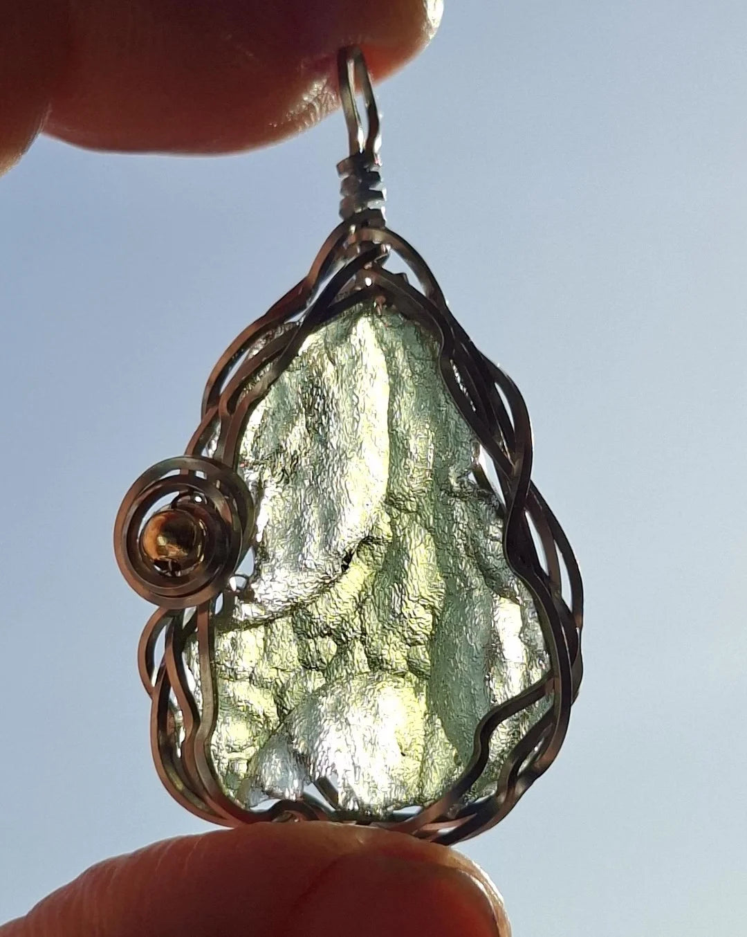 Transparent green 2.0 g Moldavite pendant from Maruškovo Pole wrapped in stainless steel wire with a gold-plated round bead