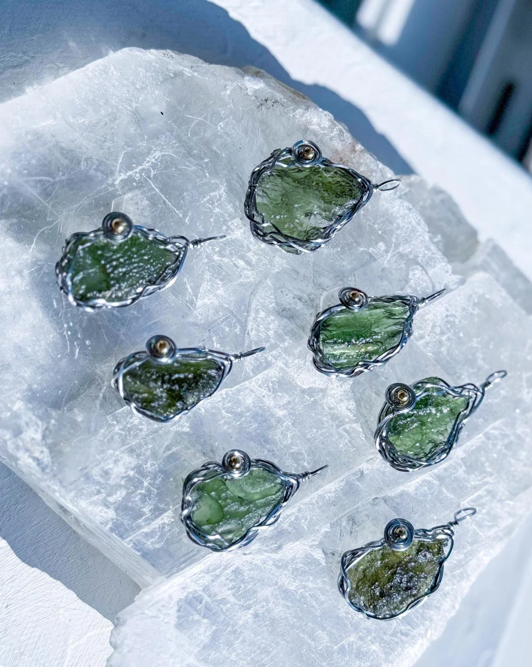 Transparent green 2.0 g Moldavite pendant from Maruškovo Pole wrapped in stainless steel wire with a gold-plated round bead