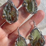 Transparent green 2.0 g Moldavite pendant from Maruškovo Pole wrapped in stainless steel wire with a gold-plated round bead