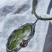 Transparent green 2.0 g Moldavite pendant from Maruškovo Pole wrapped in stainless steel wire with a gold-plated round bead