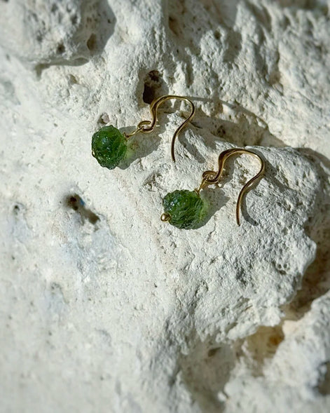 Raw drilled Chlum Moldavite earrings with naturally rounded green stones and gold-plated hooks