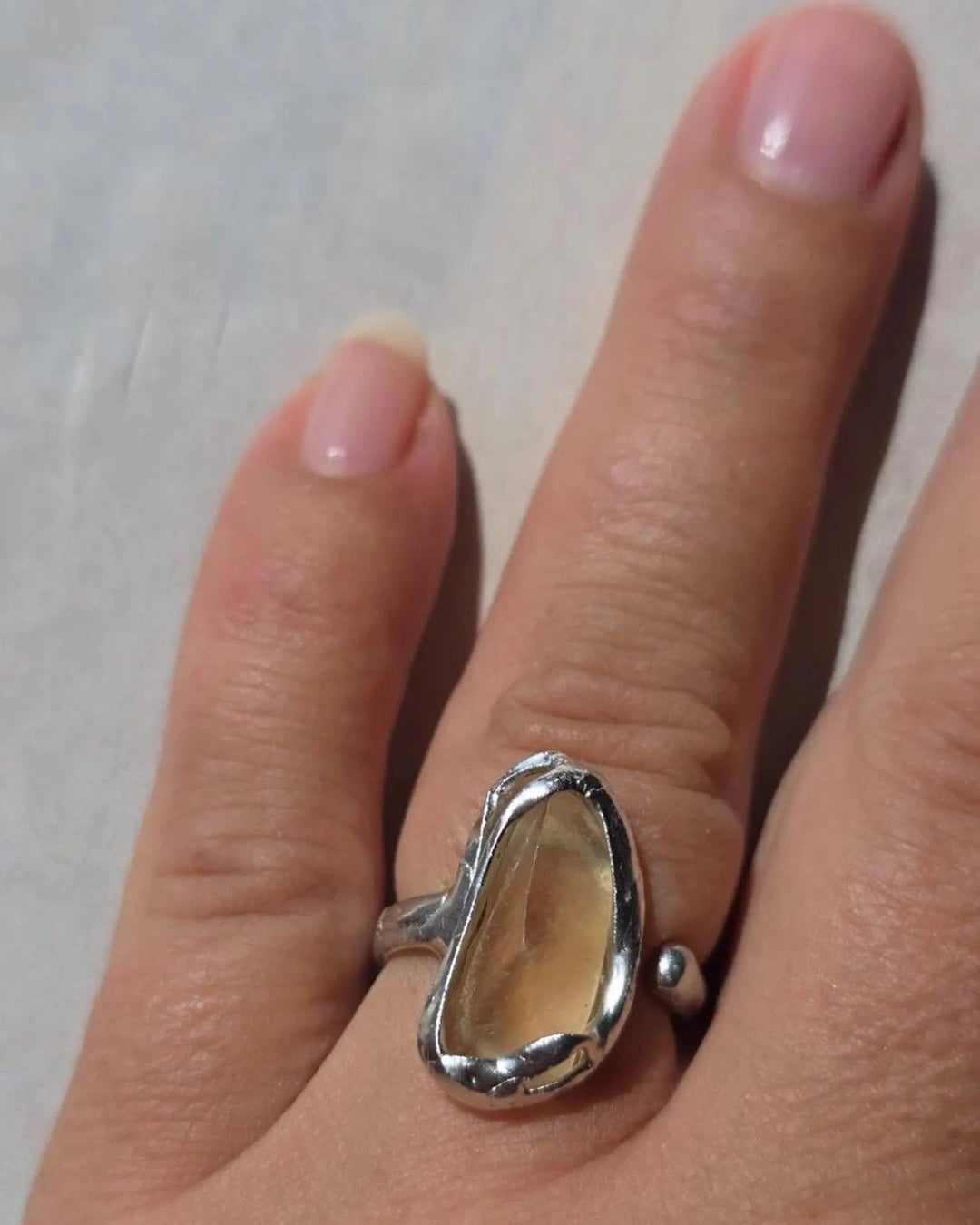 Adjustable ring with 1.2g translucent yellow Libyan Desert Glass from the Great Sand Sea, set in lead-free tin with silver content.