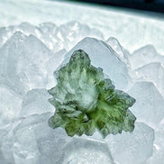Transparent 1.34g Ježkovna Moldavite with spiked sculpting and a large open bubble