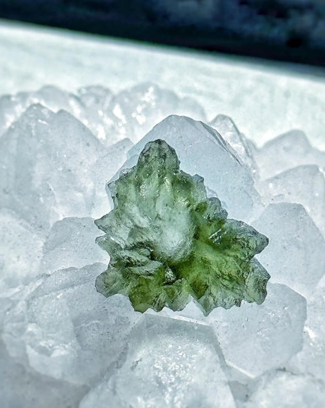 Transparent 1.34g Ježkovna Moldavite with spiked sculpting and a large open bubble