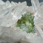 Transparent 1.34g Ježkovna Moldavite with spiked sculpting and a large open bubble