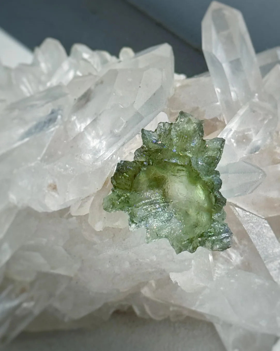 Transparent 1.34g Ježkovna Moldavite with spiked sculpting and a large open bubble