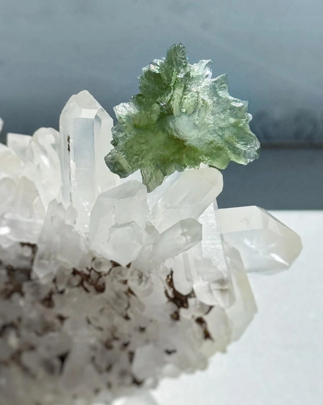 Transparent 1.34g Ježkovna Moldavite with spiked sculpting and a large open bubble
