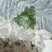 Transparent 1.34g Ježkovna Moldavite with spiked sculpting and a large open bubble
