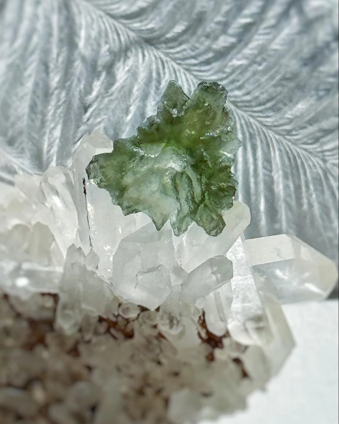 Transparent 1.34g Ježkovna Moldavite with spiked sculpting and a large open bubble