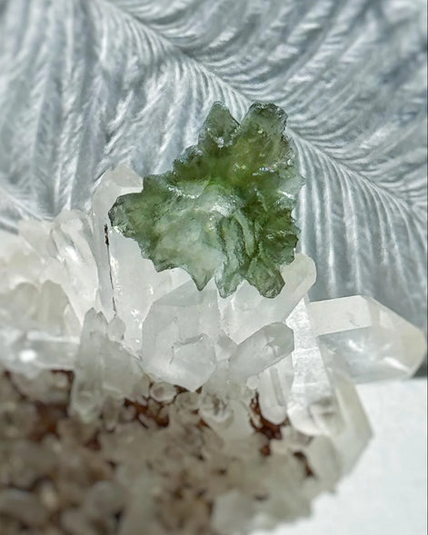 Transparent 1.34g Ježkovna Moldavite with spiked sculpting and a large open bubble