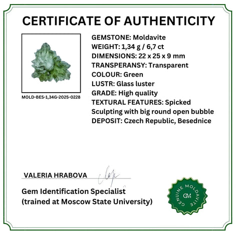 Transparent 1.34g Ježkovna Moldavite with spiked sculpting and a large open bubble