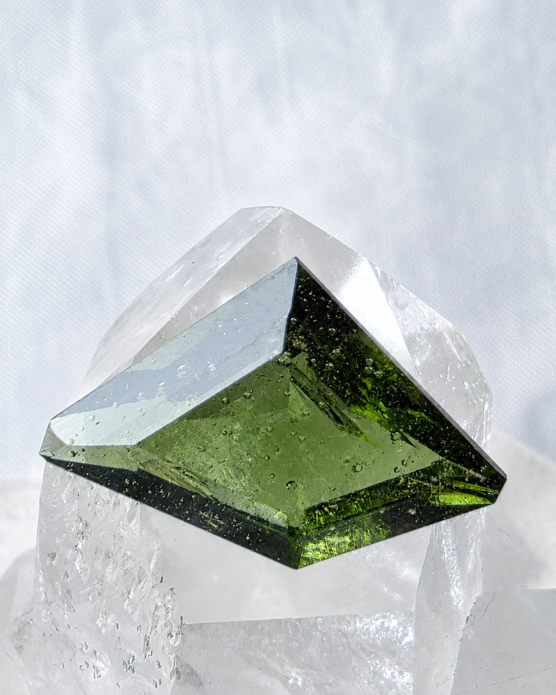 Transparent green fantasy cut Moldavite from Slavče, Czech Republic.
