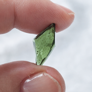 Transparent green fantasy cut Moldavite from Slavče, Czech Republic.