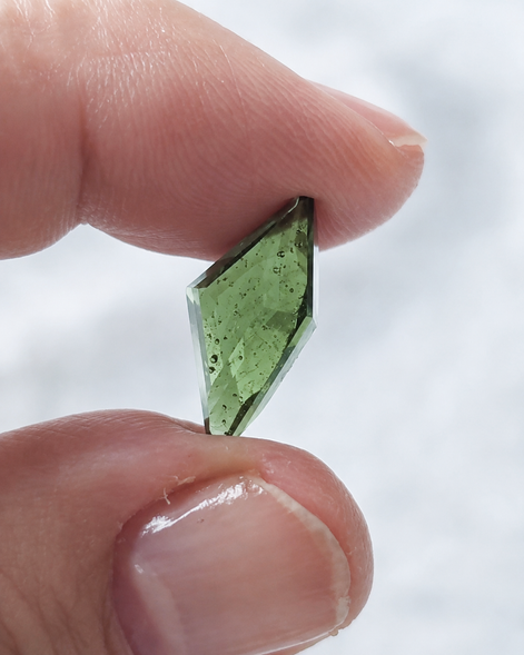 Transparent green fantasy cut Moldavite from Slavče, Czech Republic.