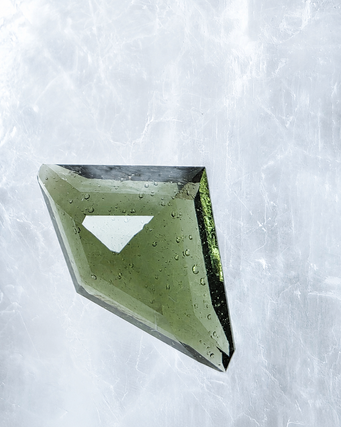 Transparent green fantasy cut Moldavite from Slavče, Czech Republic.
