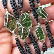 Moldavite bracelet worn on wrist, showing scale