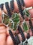 Moldavite bracelet worn on wrist, showing scale