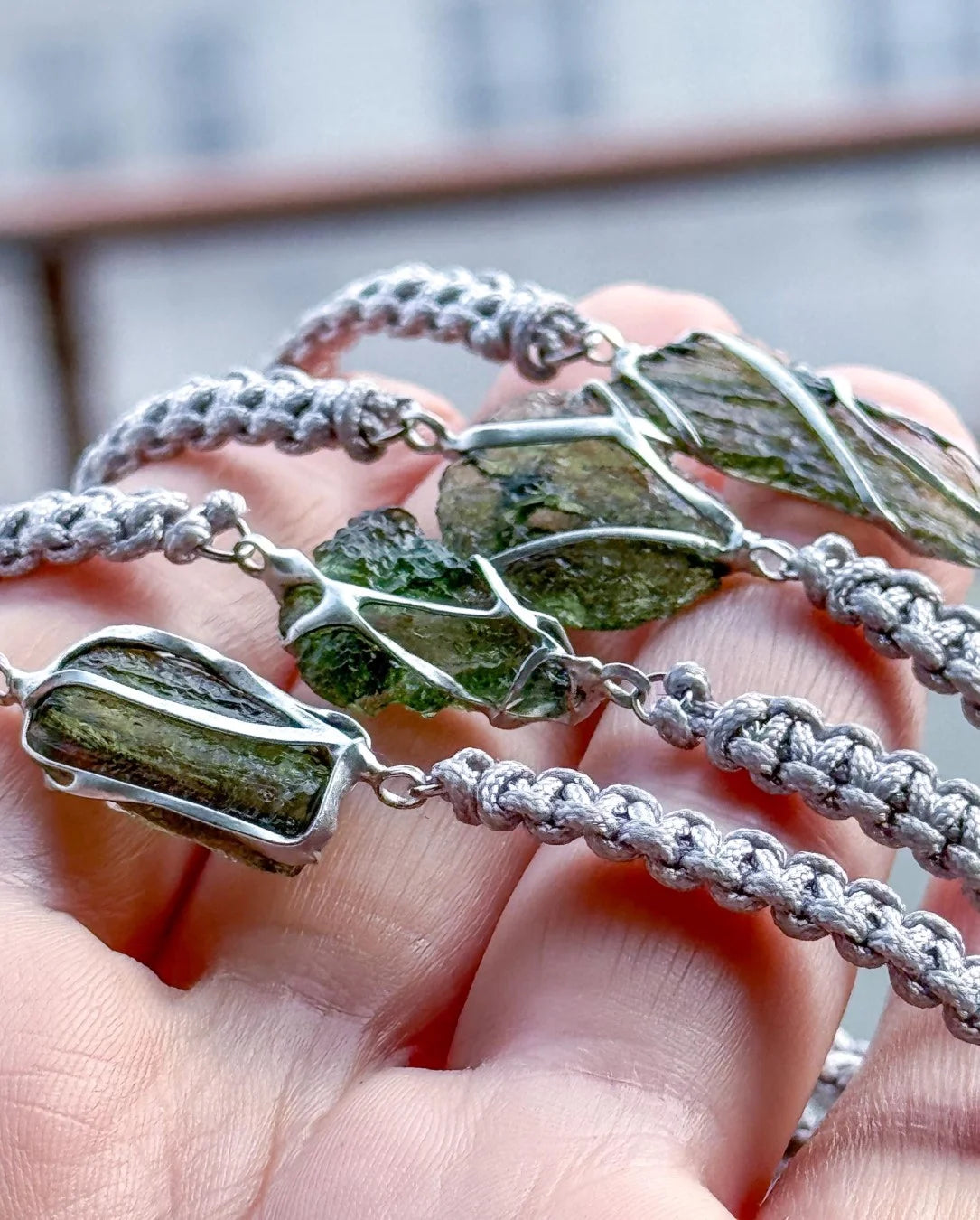 Moldavite bracelet with 0.8g transparent stone from Chlum on grey braided cord
