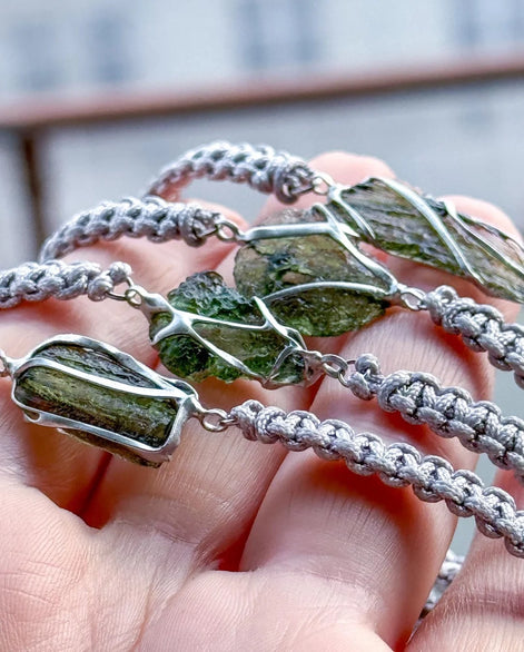 Moldavite bracelet with 0.8g transparent stone from Chlum on grey braided cord