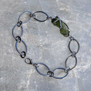 Moldavite bracelet with chunky oval-link chain and 0.8g Chlum stone