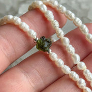 Natural drilled 0.4g Chlum Moldavite necklace with freshwater pearls and sterling silver.