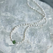 Natural drilled 0.4g Chlum Moldavite necklace with freshwater pearls and sterling silver.