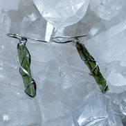 Raw Moldavite earrings with a 0.8 g pair of translucent green stones from Jankov, Czech Republic, in handcrafted open settings