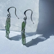 Raw Moldavite earrings with a 0.8 g pair of translucent green stones from Jankov, Czech Republic, in handcrafted open settings