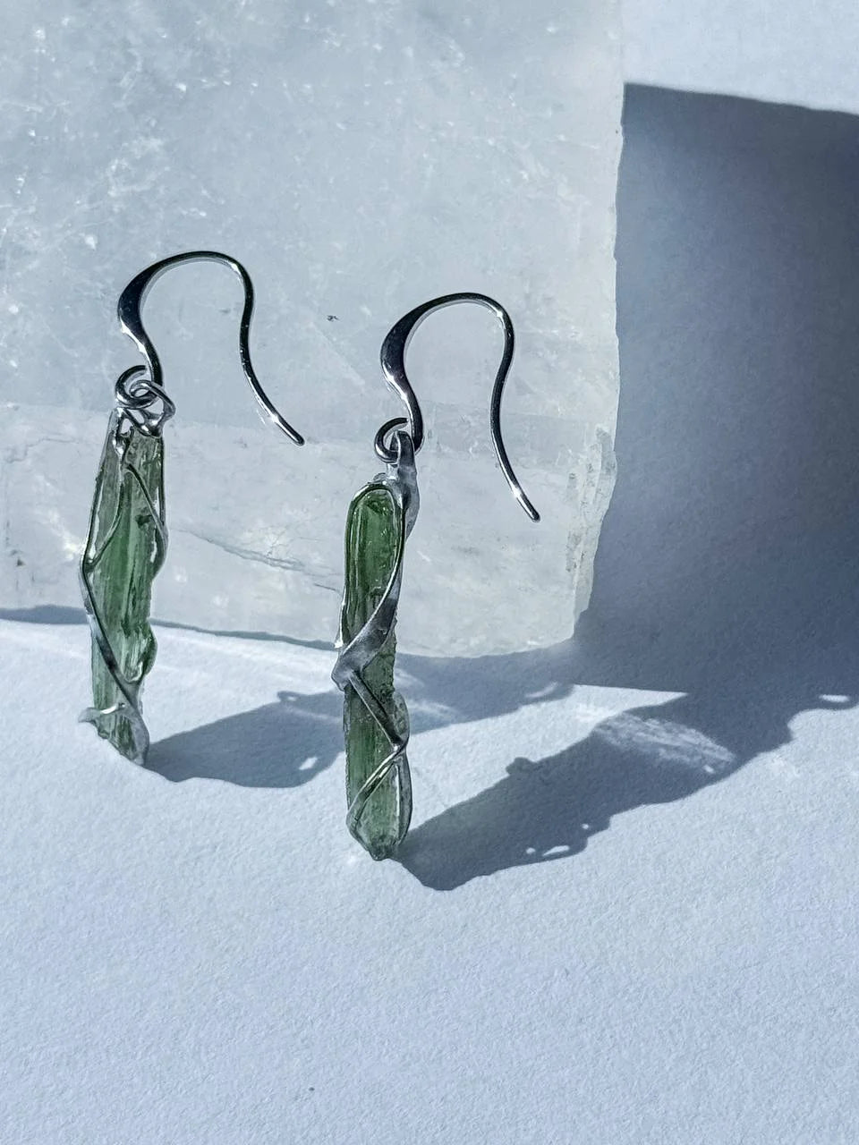Raw Moldavite earrings with a 0.8 g pair of translucent green stones from Jankov, Czech Republic, in handcrafted open settings