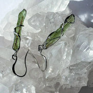 Raw Moldavite earrings with a 0.8 g pair of translucent green stones from Jankov, Czech Republic, in handcrafted open settings.