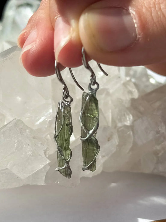 Raw Moldavite earrings with a 0.8 g pair of translucent green stones from Jankov, Czech Republic, in handcrafted open settings
