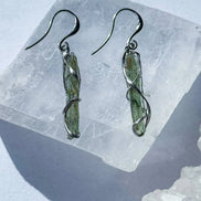 Raw Moldavite earrings with a 0.8 g pair of translucent green stones from Jankov, Czech Republic, in handcrafted open settings.