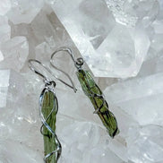 Raw Moldavite earrings with a 0.8 g pair of translucent green stones from Jankov, Czech Republic, in handcrafted open settings.