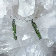 Raw Moldavite earrings with a 0.8 g pair of translucent green stones from Jankov, Czech Republic, in handcrafted open settings.