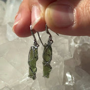 Raw Moldavite earrings with a 0.8 g pair of translucent green stones from Jankov, Czech Republic, in handcrafted open settings
