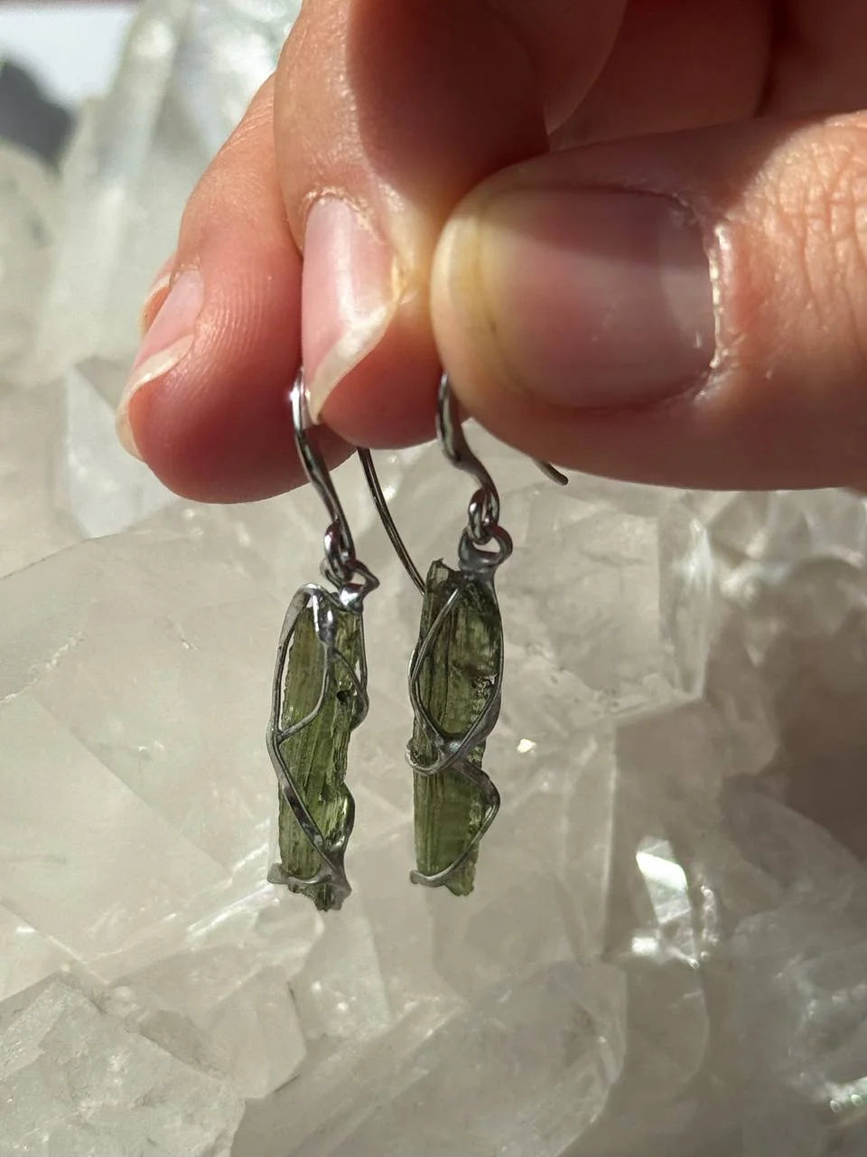 Raw Moldavite earrings with a 0.8 g pair of translucent green stones from Jankov, Czech Republic, in handcrafted open settings