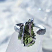 Adjustable ring with a genuine 1.23 g transparent green raw Moldavite from Chlum, Czech Republic, set in lead-free jewellery tin with silver admixture.