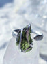 Adjustable ring with a genuine 1.23 g transparent green raw Moldavite from Chlum, Czech Republic, set in lead-free jewellery tin with silver admixture.