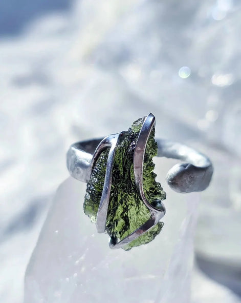 Adjustable ring with a genuine 1.23 g transparent green raw Moldavite from Chlum, Czech Republic, set in lead-free jewellery tin with silver admixture.
