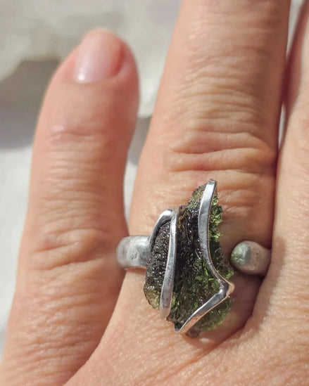 Adjustable ring with a genuine 1.23 g transparent green raw Moldavite from Chlum, Czech Republic, set in lead-free jewellery tin with silver admixture.
