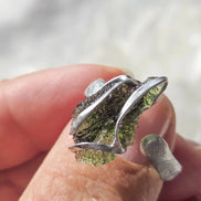 Adjustable ring with a genuine 1.23 g transparent green raw Moldavite from Chlum, Czech Republic, set in lead-free jewellery tin with silver admixture.
